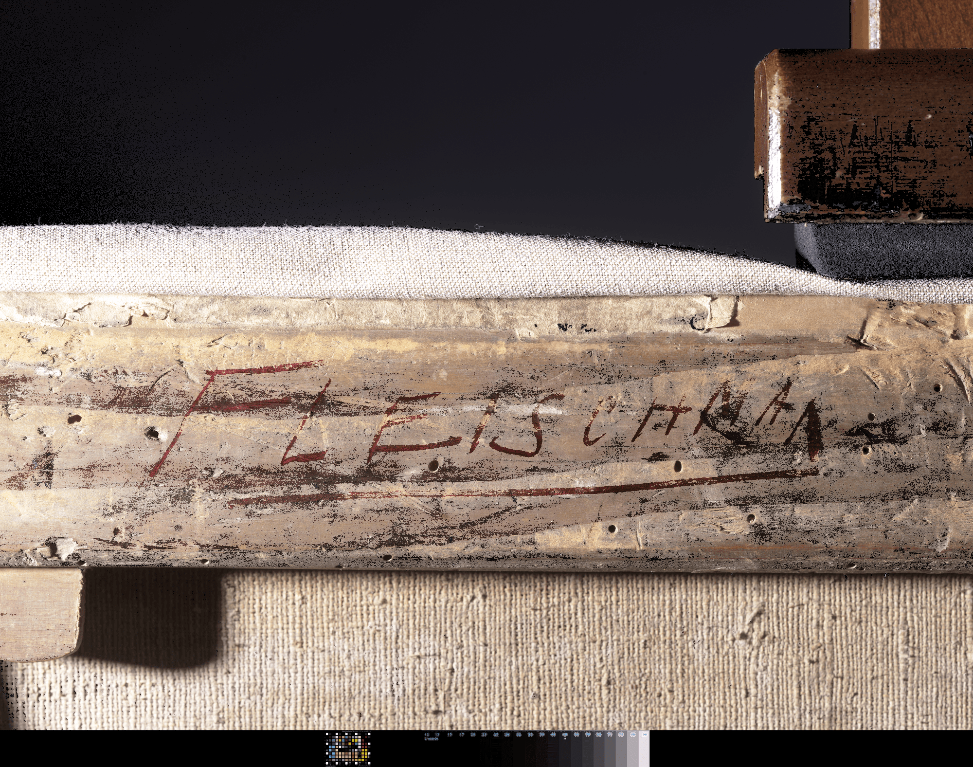 Detail of frame with red letters made visible