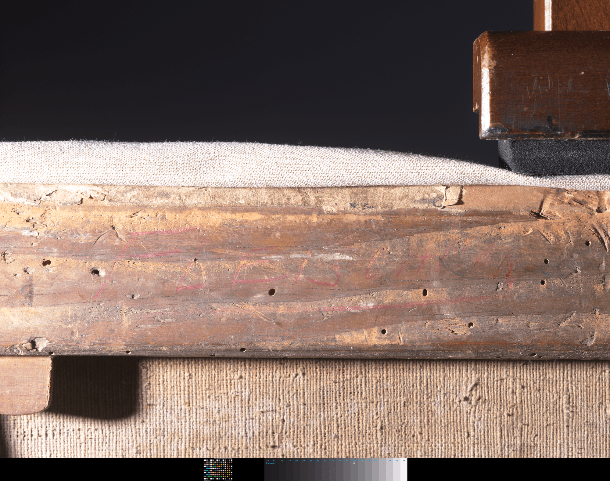 Detail of frame with hard to read red letters