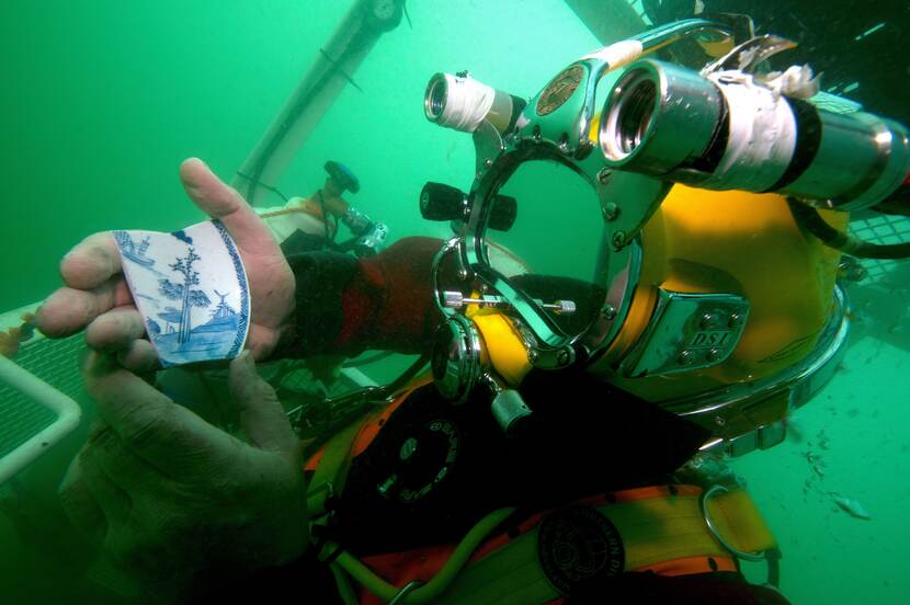 Diver with findings from a wrecksite